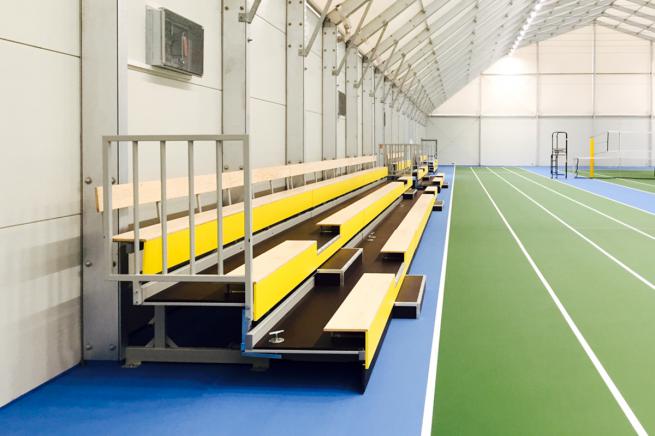 Retractable spectator stand - with bench-style seating
